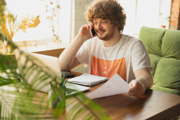 Caucasian upset and despair man watching financial and economical reports with income reduction...