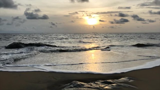 Amazing sunset over the ocean in Atlantic coast of Cameroon. Kribi town.