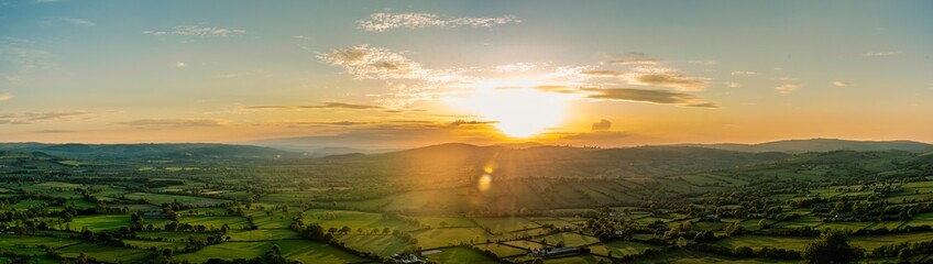 Sunset over the fields, landscape panorama, Hills on Church Stretton, Carding Mill Valley,  England, Europe