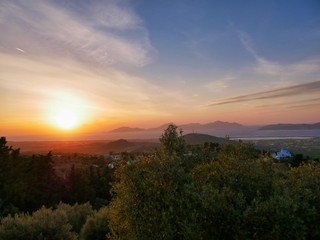 Romantic sunset over the island kos in greece with bright colors in the sky