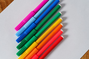 Colored markers on a white sheet
