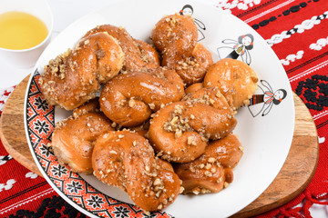 Concept of romanian cuisine. Homemade Mucenici, traditional desserts made in the figure 8