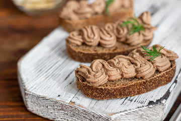 Fresh homemade chicken liver pate with carrots, onions and butter. Garnished with a sprig of dill....