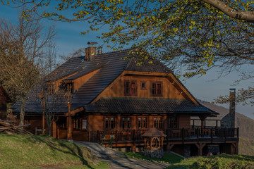Wooden building in Pustevny in spring sunny nice morning