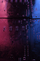 Abstract electronic circuit board, computer motherboard lines and components, beautiful red and blue color