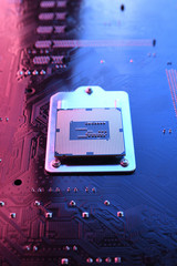 Computer cpu processor chip on circuit board ,motherboard background. Close-up. With red-blue...