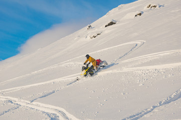 snowmobile in winter in the mountains