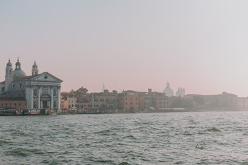 Fototapeta premium The beautiful, sunny streets of Venice, ancient buildings, canals and roofs