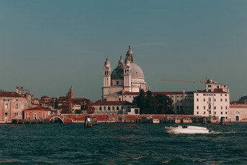 Fototapeta premium The beautiful, sunny streets of Venice, ancient buildings, canals and roofs