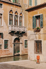 The beautiful, sunny streets of Venice, ancient buildings, canals and roofs