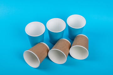 Paper glasses isolated on blue backgroud. Eco friendly, compostable tableware, disposable, recyclable on white background. Zero plastic, planet preservation, stop plastic. Recycling concept.