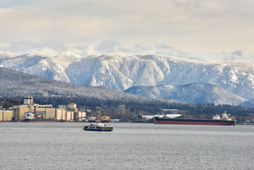 Vancouver Seabus crossing Burrard Inlet. Commuters travel across Burrard Inlet to downtown Vancouver in the morning.

