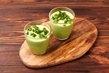 green smoothie with avocado, cucumber, celery and thyme.