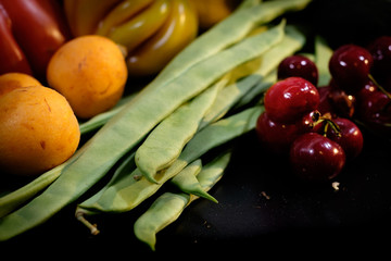 Fruit presentation with various colorful fresh fruits and vegetables