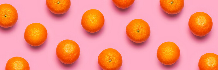 Fruit pattern, creative summer concept. Fresh juicy whole orange on pink background. Flat lay Top view. Minimalistic background with citrus fruits, vitamin C. Pop art design Banner
