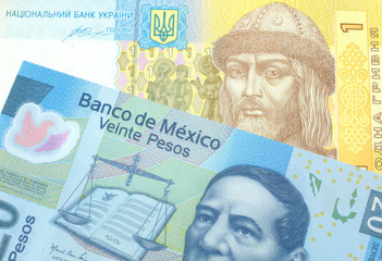 A close up image of a Mexican twenty peso note with a yellow and blue Ukrainian hryvnia bill close up in macro