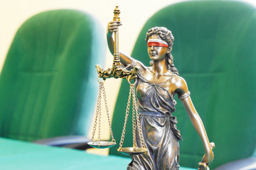 Themis, symbol of justice, with white and red bandana - Polish flag