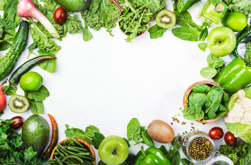 Variety of green vegetables and fruits. Healthy food clean eating: vegetable, seeds, superfood, leaf vegetable, herbs on white background, source of vegetarian proteins and detox diet nutrition