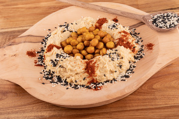 Fried or oven roasted chickpeas and hummus paste spiced turmeric curcuma