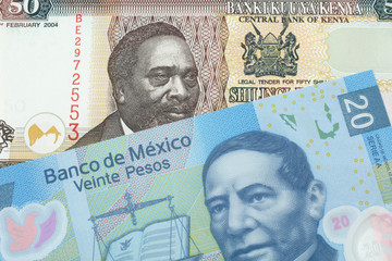 A fifty Kenyan shilling note, in macro, close up with a 20 peso note from Mexico