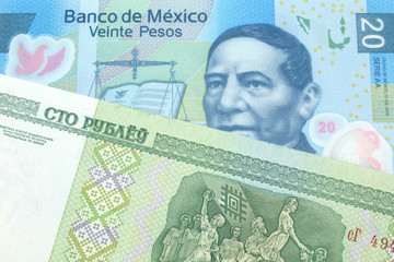 A close up image of a twenty peso note from Mexico with a one hundred ruble note from Belarus