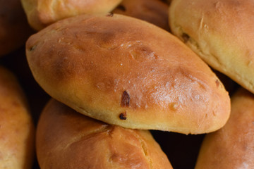 Homemade baking. Pies with filling. Concept: traditional Slavic cuisine, Russian pies.