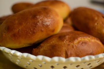 Homemade baking. Pies with filling. Concept: traditional Slavic cuisine, Russian pies.