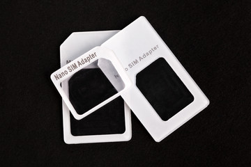 SIM card adapter with pin for mini, nano and micro sim card. Adapters on the sim card from larger...