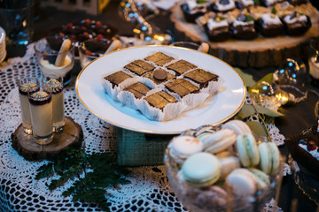 Candy Bar close up. Delicious sweet buffet with cupcakes. Sweet wedding buffet with cupcakes and other desserts.