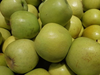 green apples in a market