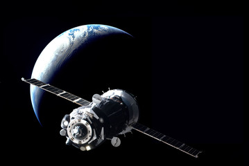 Russian manned spacecraft in orbit around the Earth. Elements of this image furnished by NASA.