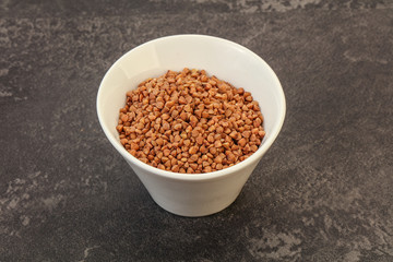 Raw buсkwheat cereal in the bowl