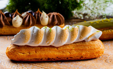 Eclairs pastry made with choux dough filled with cream and topping.Fresh Food Buffet Brunch Catering