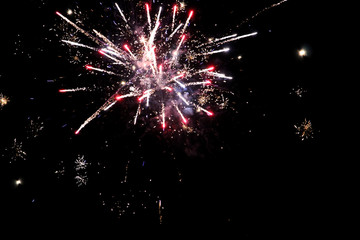 Obraz premium Close up of red fireworks explosion at night