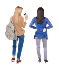 Back view of two woman in sweater.