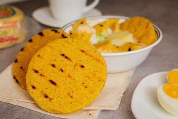 Egg broth with arepa of corn pelao. Typical Colombian breakfast (arepa Santandereana)