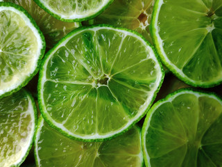 Background consisting of lime slices...