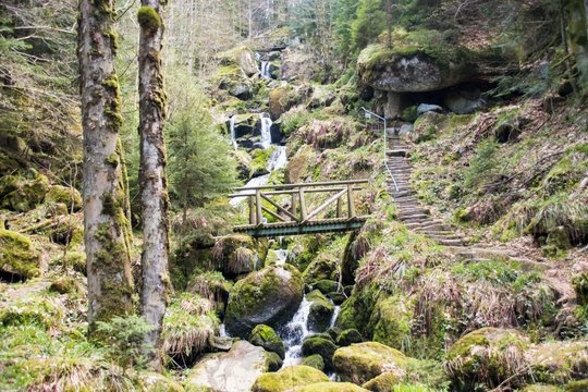 A cascade with a bridge across the stream in Germany
