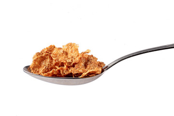close of spoon with muesli on white background