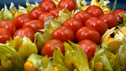 Fototapeta na wymiar Culinary travel. Vegetarian. Physalis peruviana with cherry tomatoes.