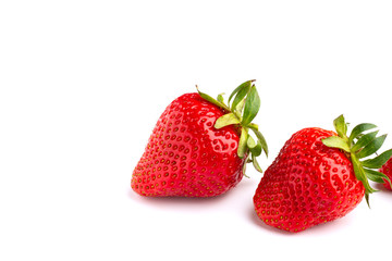 A pair of strawberries on white isolated background