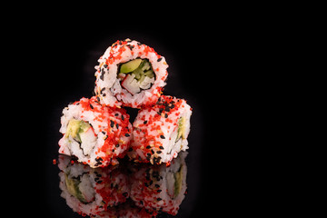 Simple sushi nigiri maki set isolated on black background. Various selection of traditional japanese