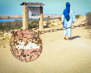 Forbidden sign with arab guy on the background