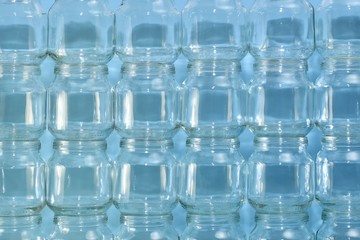 The background is from the built wall of transparent small cans, horizontal enlarged fragment in the center.