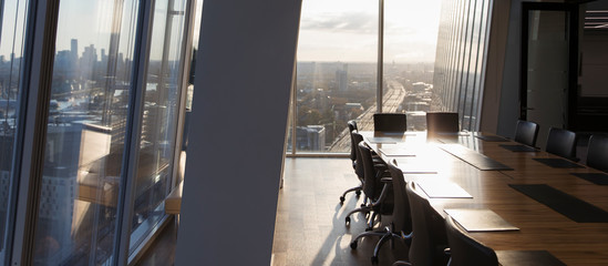 Sunny empty modern conference room with city view