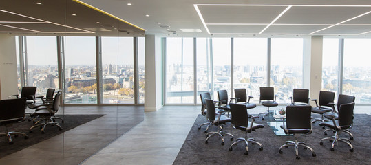 Chairs in a circle in modern highrise conference room