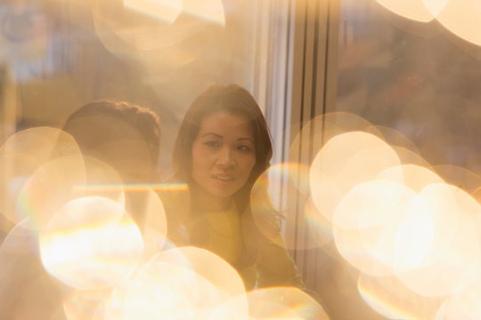 Businesswoman talking with colleague in sunny office