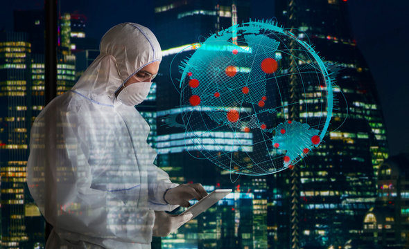 Scientist in clean suit working late during coronavirus pandemic