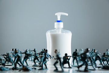 Toy soldiers guarding hand soap during COVID-19 pandemic