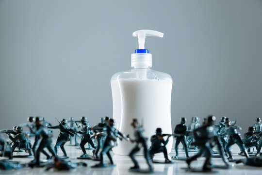 Toy soldiers guarding hand soap during COVID-19 pandemic